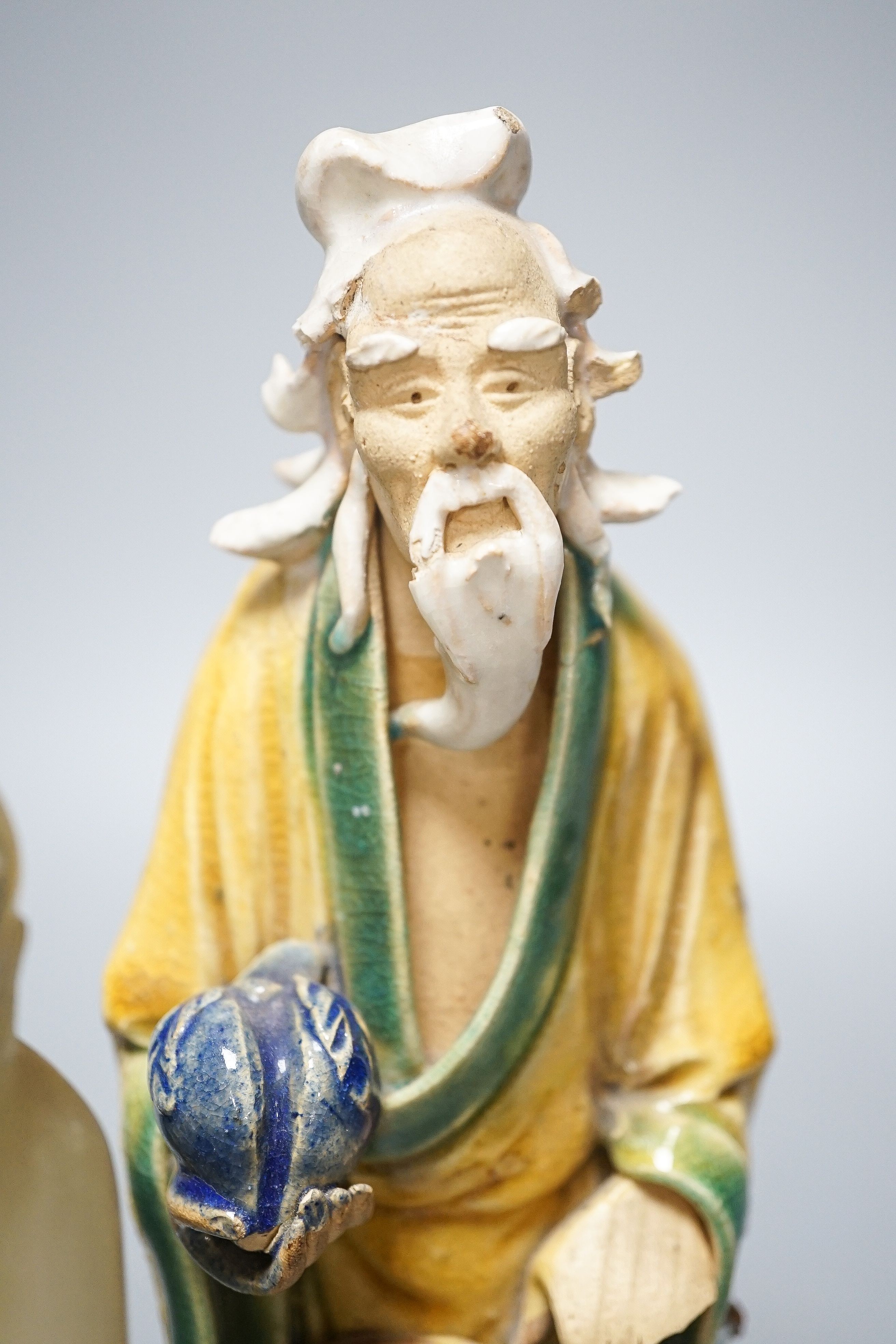 A Chinese glazed biscuit lion-dog seal, a Chinese blue and white tureen, width 18cm, two Shiwan figures and two teabowls, four saucers and a soapstone carving 20cm